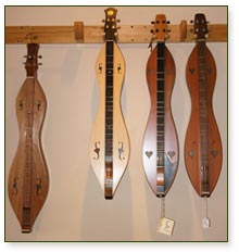 mountain dulcimers hanging on wall